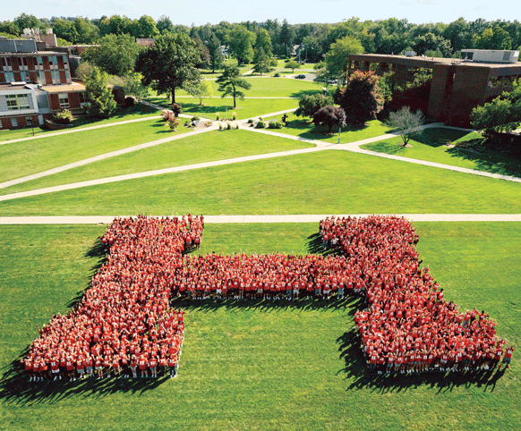 A photo of incoming students making the shape of an H