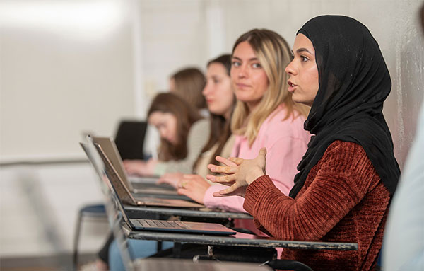 Student participating in a classroom discussion