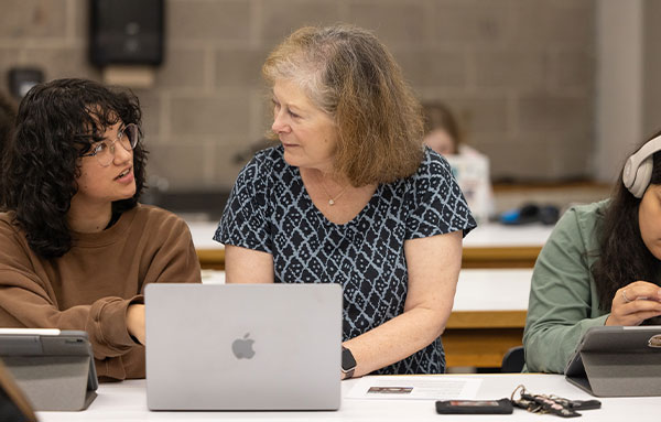 Uhart student and professor discussing work