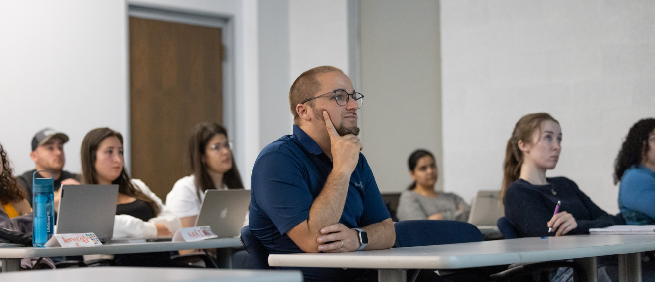 Graduate students in classroom. 