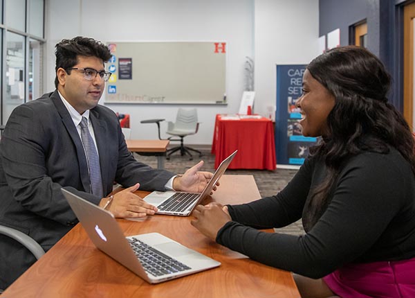 Student and staff in career studio. 