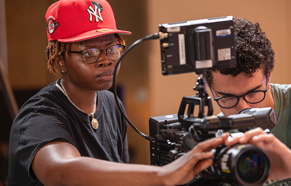 Students with video equipment. 