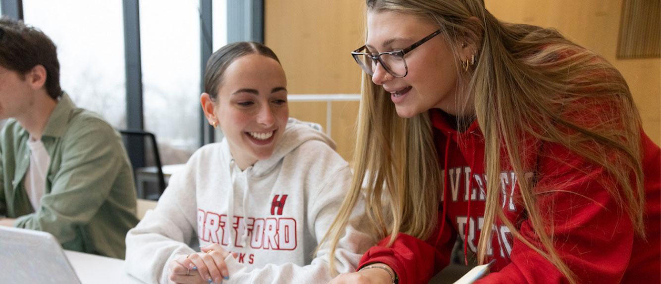 Uhart students in classroom talking 