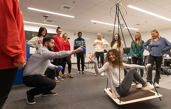 students using therapy swing