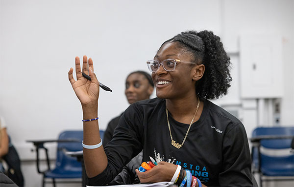 Student engaging in a classroom discussion.