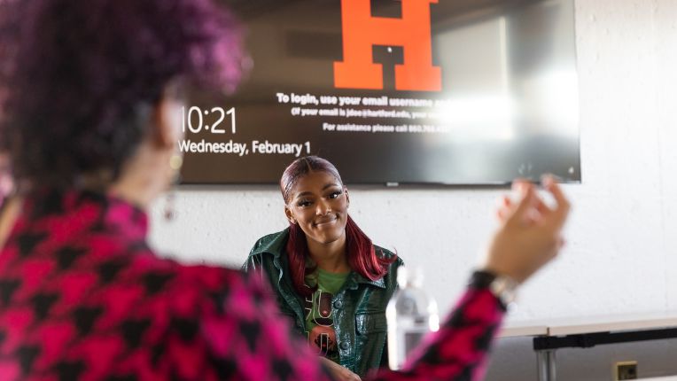 Two female students chat about transferring to University of Hartford.
