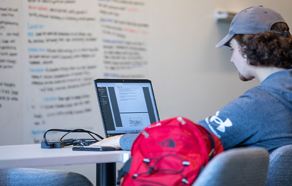 student working on computer