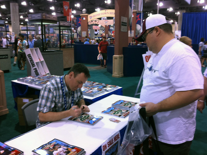 Speakman signing sports memorabilia 