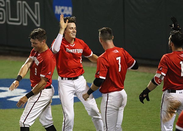 Jackson Olson celebrating with Hartford Baseball teammates