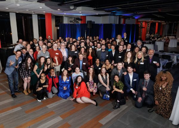 STN club pose for a large group photo during their reunion in Gengras Student Union.