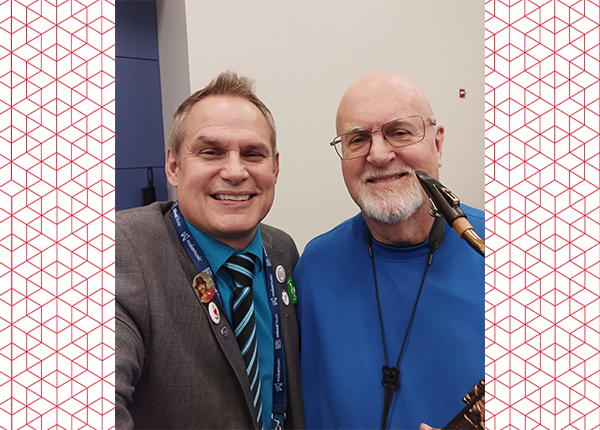 Anthony Susi posing with someone.