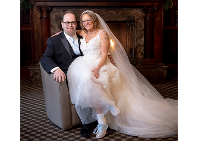 Jodi Green and her husband posing on their wedding day.