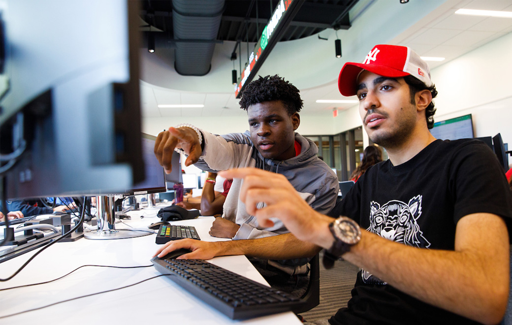 Barney students having a discussion in the trading lab