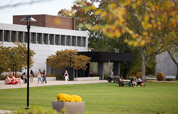 Students walking outside GSU in the fall