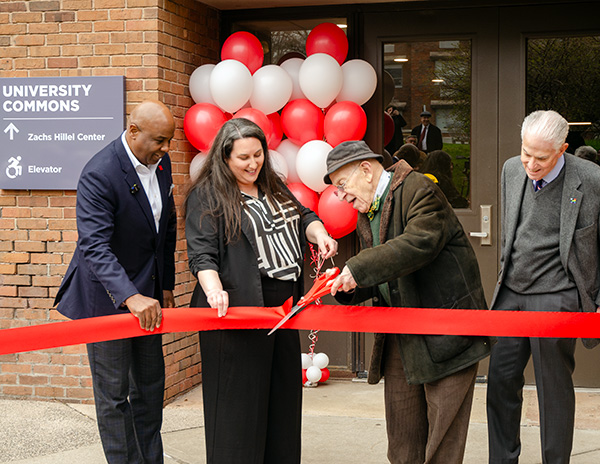 President Lawrence P. Ward, Lisa Langsner, Henry Zachs, and Walter Harrison cut the ribbon on the Zachs Hillel Center