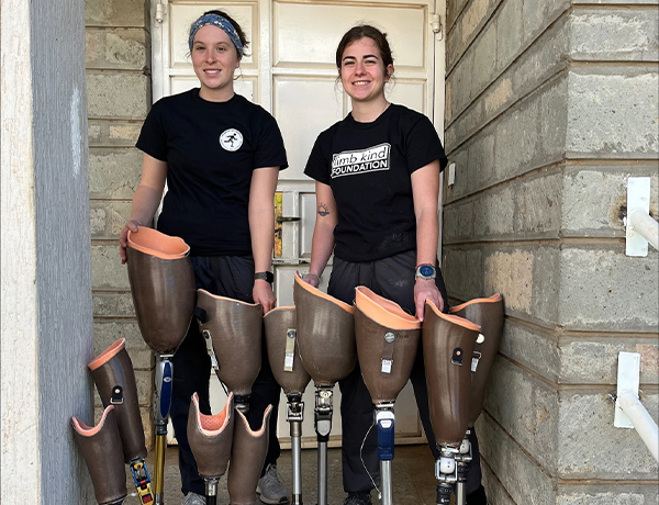 Graduate students with prosthetic legs in Kenya