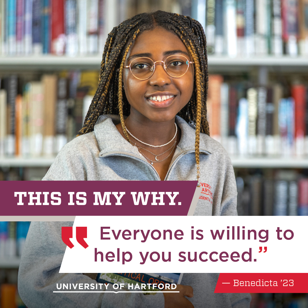 student standing in the library