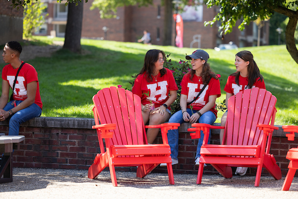 students sitting during move in