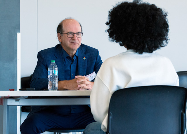 Student being interviewed by Donald Allan, Jr. ’86, executive chair of Stanley Black & Decker and chair of UHart’s Board of Regents,