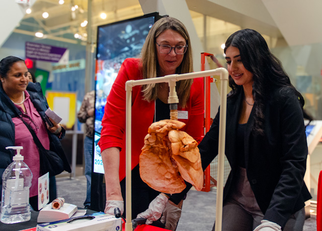 UHart student with exhibit at the Science Center