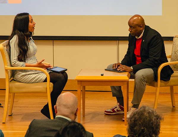 Author, attorney, and activist Haben Girma takes a question from University of Hartford President Lawrence P. Ward