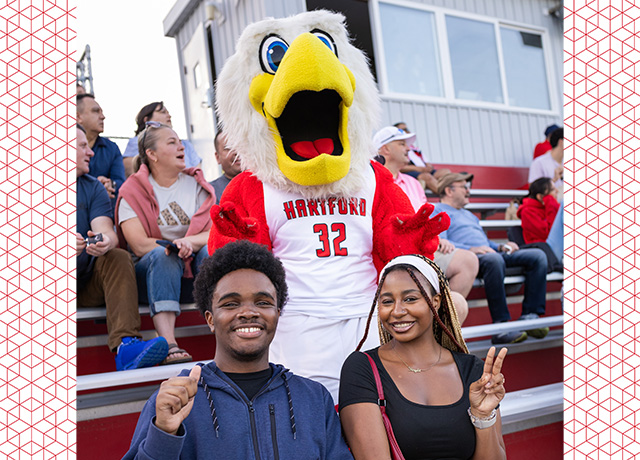 Howie celebrating Hawktober with UHart students