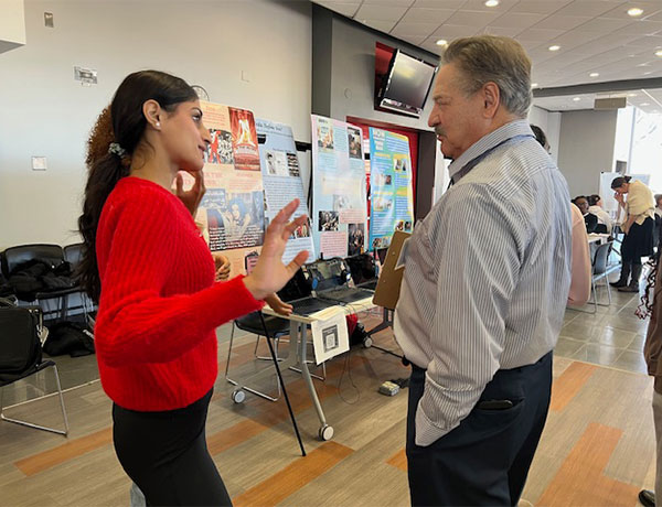 two people at A&S symposium