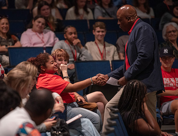 President Ward greeting a student