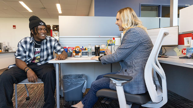 student and advisor in discussion 