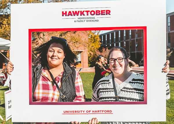 UHart students posing during Hawktober Weekend.