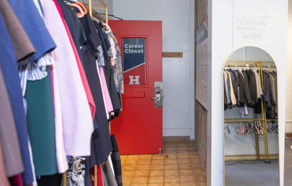 A rack of professional business attire hanging on a rack in the Career Closet.