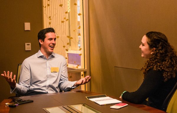 A UHart student sits with a professional during Career Exploration Day.