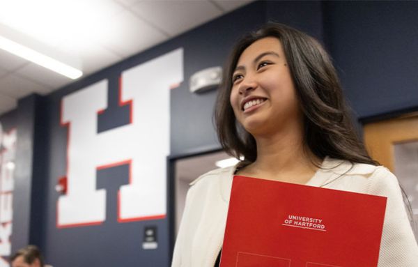 A UHart student beams with pride as she lands a job before graduation.