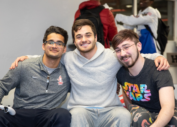 group of students sitting together and smiling 